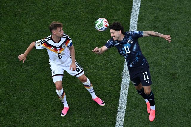 Paraguay's midfielder #11 Mauricio heads the ball past Germany's defender #06 Joshua Kimmich during the 2026 World Cup round of 32 football match between Germany and Paraguay at the Boston Stadium in Foxborough on June 29, 2026.  (Photo by Jewel SAMAD / AFP)