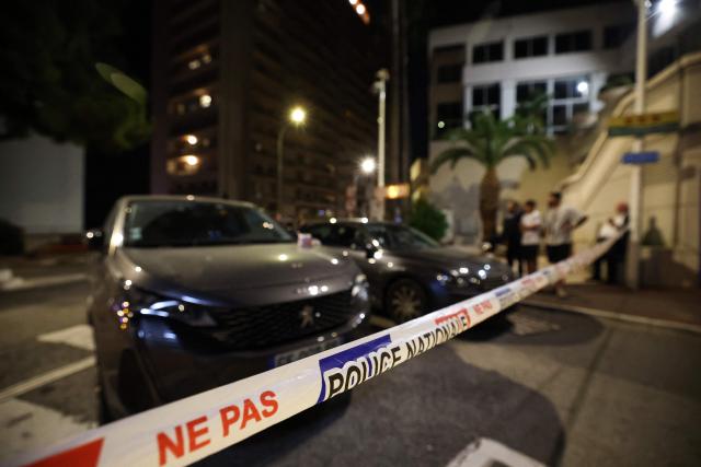 This photograph shows a police security tape near the area of an explosion that occurred in a residential building in Monaco, near the border with France on June 29, 2026. Three people were injured — two of them very seriously — in the explosion of an explosive device in Monaco in the evening. The blast at a residential building was "very likely an attack", Monaco's Minister of State (head of government) told AFP. Public prosecutor said a suspect had left a bag or package in the building's lobby before leaving. Nothing appeared for the moment to indicate why the building might have been targeted, he said. (Photo by Valery HACHE / AFP)