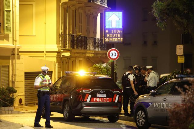 Monacan and French police officers stand near the area of an explosion that occurred in a residential building in Monaco, near the border with France on June 29, 2026. Three people were injured — two of them very seriously — in the explosion of an explosive device in Monaco in the evening. The blast at a residential building was "very likely an attack", Monaco's Minister of State (head of government) told AFP. Public prosecutor said a suspect had left a bag or package in the building's lobby before leaving. Nothing appeared for the moment to indicate why the building might have been targeted, he said. (Photo by Valery HACHE / AFP)
