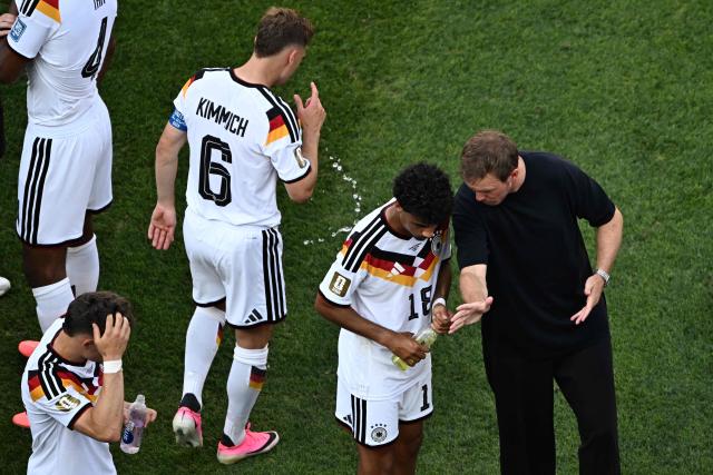 Germany's head coach Julian Nagelsmann speaks to defender #18 Nathaniel Brown during the hydration break of the 2026 World Cup round of 32 football match between Germany and Paraguay at the Boston Stadium in Foxborough on June 29, 2026.  (Photo by Jewel SAMAD / AFP)