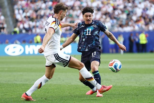 Germany's midfielder #08 Leon Goretzka and Paraguay's midfielder #11 Mauricio fight for the ball during the 2026 World Cup round of 32 football match between Germany and Paraguay at the Boston Stadium in Foxborough on June 29, 2026.  (Photo by CHARLY TRIBALLEAU / AFP)