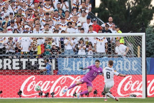 Germany's defender #06 Joshua Kimmich scores a penalty kick past Paraguay's goalkeeper #12 Orlando Gill during the penalty shootout of the 2026 World Cup round of 32 football match between Germany and Paraguay at the Boston Stadium in Foxborough on June 29, 2026.  (Photo by Odd ANDERSEN / AFP)