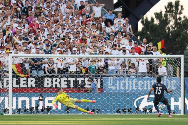 Paraguay's defender #15 Gustavo Gomez scores a penalty kick past Germany's goalkeeper #01 Manuel Neuer during the penalty shootout of the 2026 World Cup round of 32 football match between Germany and Paraguay at the Boston Stadium in Foxborough on June 29, 2026.  (Photo by Odd ANDERSEN / AFP)