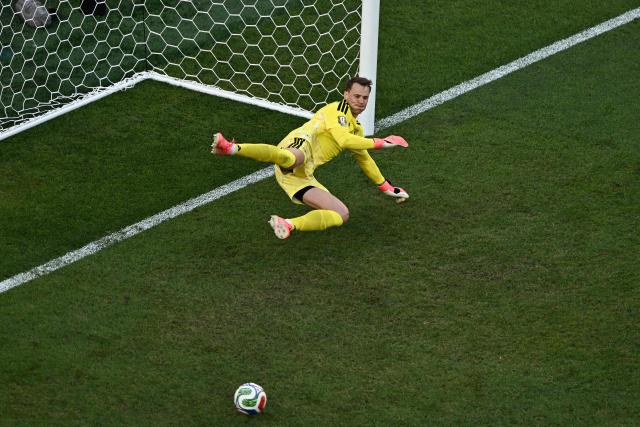 Germany's goalkeeper #01 Manuel Neuer saves a penalty kick by Paraguay's forward #09 Antonio Sanabria during the penalty shootout of the 2026 World Cup round of 32 football match between Germany and Paraguay at the Boston Stadium in Foxborough on June 29, 2026.  (Photo by Jewel SAMAD / AFP)