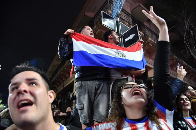 Paraguayan fans celebrate after watching a live broadcast of the 2026 FIFA World Cup football match between Germany and Paraguay in Asuncion on June 29, 2026. (Photo by DANIEL DUARTE / AFP)