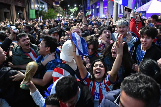 Paraguayan fans celebrate after their victory watching a live broadcast of the 2026 FIFA World Cup football match between Germany and Paraguay in Asuncion on June 29, 2026. (Photo by DANIEL DUARTE / AFP)