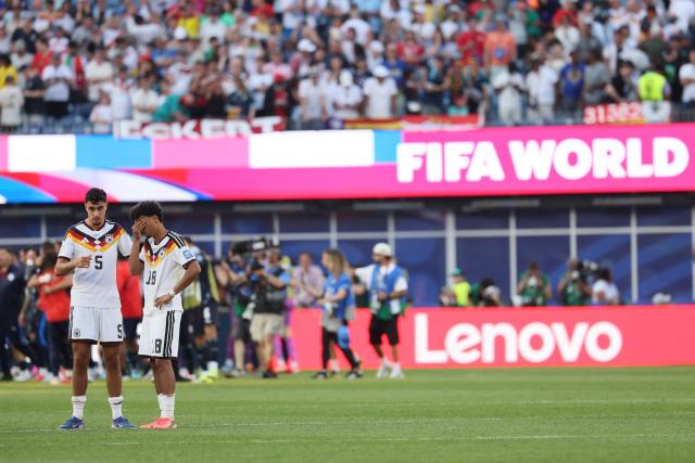 Germany's defender #05 Aleksandar Pavlovic and defender #18 Nathaniel Brown react after losing the penalty shootout of the 2026 World Cup round of 32 football match between Germany and Paraguay at the Boston Stadium in Foxborough on June 29, 2026.  (Photo by Odd ANDERSEN / AFP)