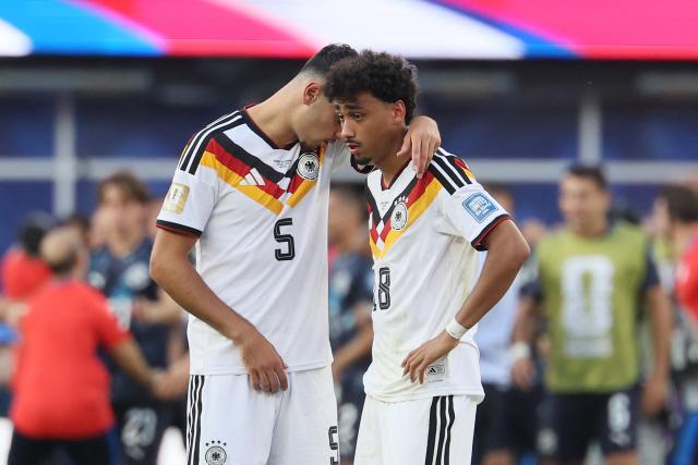 Germany's defender #05 Aleksandar Pavlovic and defender #18 Nathaniel Brown react after losing the penalty shootout of the 2026 World Cup round of 32 football match between Germany and Paraguay at the Boston Stadium in Foxborough on June 29, 2026.  (Photo by Odd ANDERSEN / AFP)