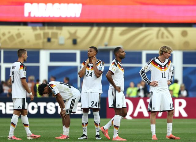 TOPSHOT - (From L) Germany's defender #03 Waldemar Anton, defender #18 Nathaniel Brown,  defender #24 Malick Thiaw, defender #04 Jonathan Tah and forward #11 Nick Woltemade react after losing the penalty shootout during the 2026 World Cup round of 32 football match between Germany and Paraguay at the Boston Stadium in Foxborough on June 29, 2026.  (Photo by FRANCK FIFE / AFP)