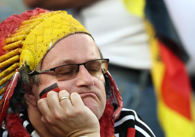 TOPSHOT - A Germany fan reacts after his team’s losing the penalty shootout during the 2026 World Cup round of 32 football match between Germany and Paraguay at the Boston Stadium in Foxborough on June 29, 2026.  (Photo by FRANCK FIFE / AFP)