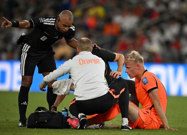 Netherlands' defender #06 Jan Paul Van Hecke receives medical attention during the 2026 World Cup round of 32 football match between the Netherlands and Morocco at the Monterrey Stadium in Guadalupe on June 29, 2026.  (Photo by CARL DE SOUZA / AFP)