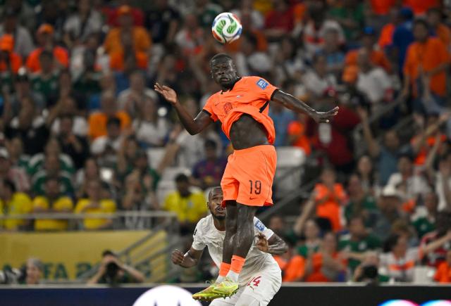 TOPSHOT - Netherlands' forward #19 Brian Brobbey jumps for the ball during the 2026 World Cup round of 32 football match between the Netherlands and Morocco at the Monterrey Stadium in Guadalupe on June 29, 2026.  (Photo by Alfredo ESTRELLA / AFP)