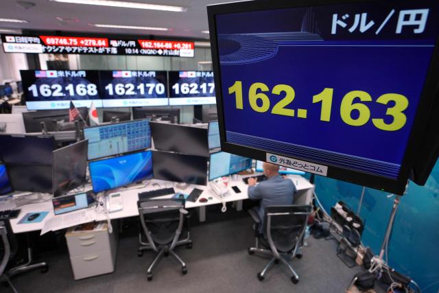 Electronic boards display the foreign exchange rate of the Japanese yen against the US dollar at a foreign exchange brokerage in Tokyo on June 30, 2026. (Photo by Kazuhiro NOGI / AFP)