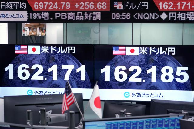 Electronic boards display the foreign exchange rate of the Japanese yen against the US dollar at a foreign exchange brokerage in Tokyo on June 30, 2026. (Photo by Kazuhiro NOGI / AFP)