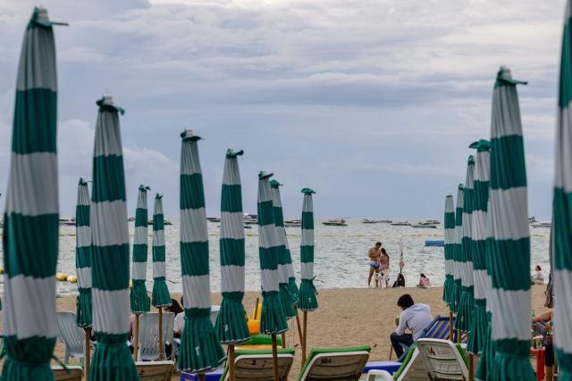 People visit Pattaya Beach in Pattaya on June 29, 2026. (Photo by ANTHONY WALLACE / AFP)