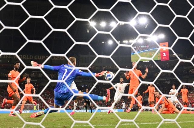 Netherlands' goalkeeper #01 Bart Verbruggen makes a save at the extra-time of the 2026 World Cup round of 32 football match between the Netherlands and Morocco at the Monterrey Stadium in Guadalupe on June 29, 2026.  (Photo by Alfredo ESTRELLA / AFP)