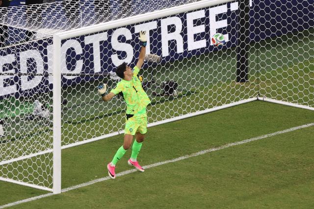 Morocco's goalkeeper #01 Yassine Bounou stops the penalty of Netherlands' forward #24 Crysencio Summerville during the penalty shootout of the 2026 World Cup round of 32 football match between the Netherlands and Morocco at the Monterrey Stadium in Guadalupe on June 29, 2026.  (Photo by Julio Cesar AGUILAR / AFP)