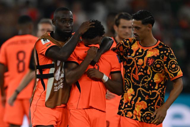 TOPSHOT - (From L) Netherlands' defender #02 Lutsharel Geertruida, midfielder #26 Quinten Timber and midfielder #14 Tijjani Reijnders react after losing in the shootout during the 2026 World Cup round of 32 football match between the Netherlands and Morocco at the Monterrey Stadium in Guadalupe on June 29, 2026.  (Photo by CARL DE SOUZA / AFP)