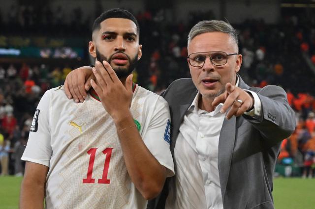 TOPSHOT - Morocco's head coach Mohamed Ouahbi and Morocco's midfielder #11 Ismael Saibari celebrate after winning in the shootout during the 2026 World Cup round of 32 football match between the Netherlands and Morocco at the Monterrey Stadium in Guadalupe on June 29, 2026.  (Photo by CARL DE SOUZA / AFP)