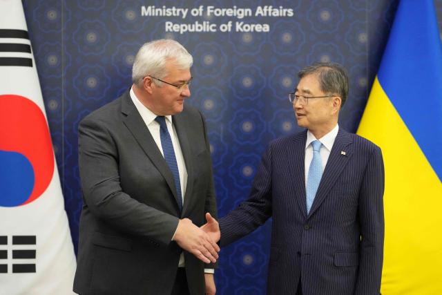 Ukraine's Foreign Minister Andrii Sybiha (L) shakes hands with South Korea's Foreign Minister Cho Hyun before their meeting at the Foreign Ministry in Seoul on June 30, 2026. (Photo by Lee Jin-man / POOL / AFP)