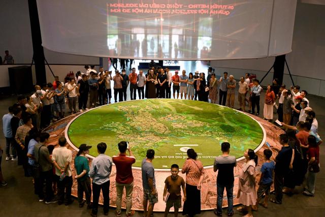 People view an exhibition for Hanoi's 100-year development master plan at the Hanoi Museum in Hanoi on June 30, 2026. (Photo by Nhac NGUYEN / AFP)