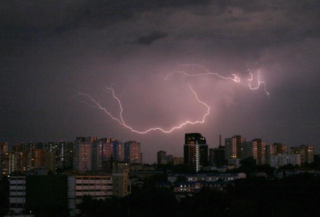 Lightning flashes light up the sky above Ukraine's capital Kyiv during a thunderstorm on June 29, 2026. (Photo by Sergei SUPINSKY / AFP)