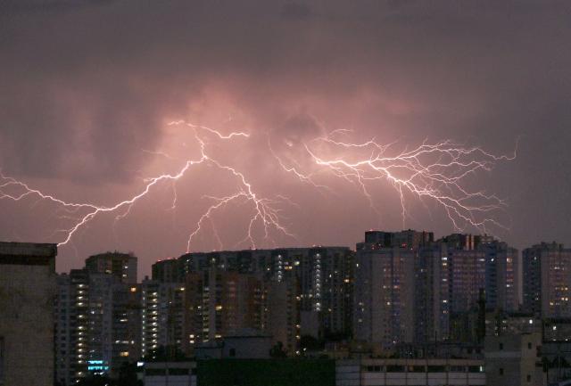 Lightning flashes light up the sky above Ukraine's capital Kyiv during a thunderstorm on June 29, 2026. (Photo by Sergei SUPINSKY / AFP)