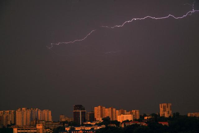 Lightning flashes light up the sky above Ukraine's capital Kyiv during a thunderstorm on June 29, 2026. (Photo by Sergei SUPINSKY / AFP)