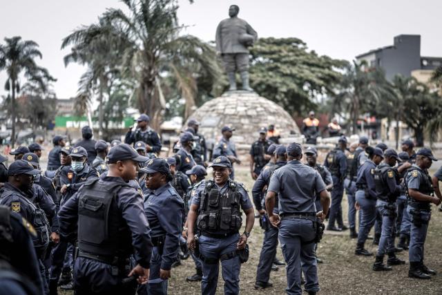 Members of the South African Police Service (SAPS) gather ahead of planned demonstrations by the March and March movement against the presence of undocumented migrants in South Africa in Durban, on June 30, 2026. South African police deployed to head off unrest and protests on June 30, 2026, the unofficial deadline set by citizen-led groups for undocumented foreign nationals to leave that has already pushed thousands to flee.
Officers were out in force to prevent violence and looting, while hundreds of foreign nationals took refuge in several cities, urgently seeking help to leave. (Photo by Marco LONGARI / AFP)
