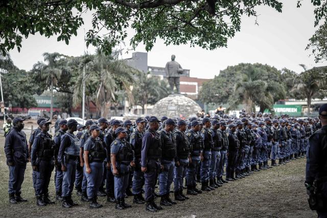 Members of the South African Police Service (SAPS) stand in formation as they receive instructions ahead of planned demonstrations by the March and March movement against the presence of undocumented migrants in South Africa in Durban, on June 30, 2026. South African police deployed to head off unrest and protests on June 30, 2026, the unofficial deadline set by citizen-led groups for undocumented foreign nationals to leave that has already pushed thousands to flee.
Officers were out in force to prevent violence and looting, while hundreds of foreign nationals took refuge in several cities, urgently seeking help to leave. (Photo by Marco LONGARI / AFP)
