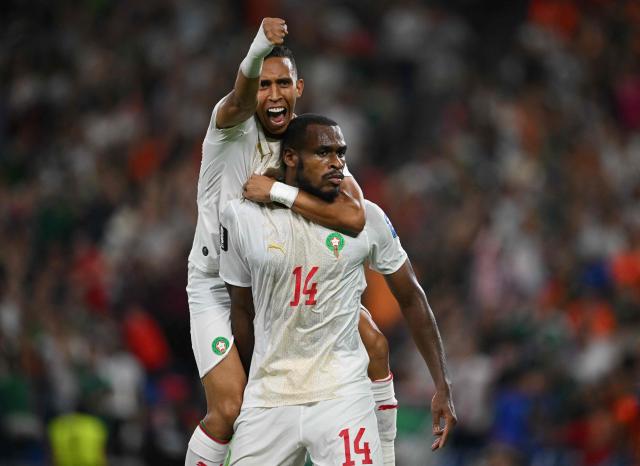 TOPSHOT - Morocco's defender #14 Issa Diop (R) celebrates scoring his team's first goal during the 2026 World Cup round of 32 football match between the Netherlands and Morocco at the Monterrey Stadium in Guadalupe on June 29, 2026.  (Photo by CARL DE SOUZA / AFP)