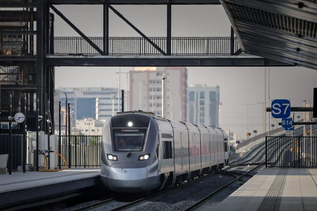 A photograph shows an Etihad Rail train, the UAE's first passenger train, on its inaugural journey at Mohamed bin Zayed City station in Abu Dhabi on June 30, 2026. The passenger service will eventually connect four of the country's seven emirates, with an "introductory operational phase" between Abu Dhabi and Fujairah to begin on June 30, state news agency WAM said earlier this month. The Dubai station will open on September 30, while the main station in the neighbouring emirate of Sharjah is set to be operational on March 30, 2027. (Photo by FADEL SENNA / AFP)