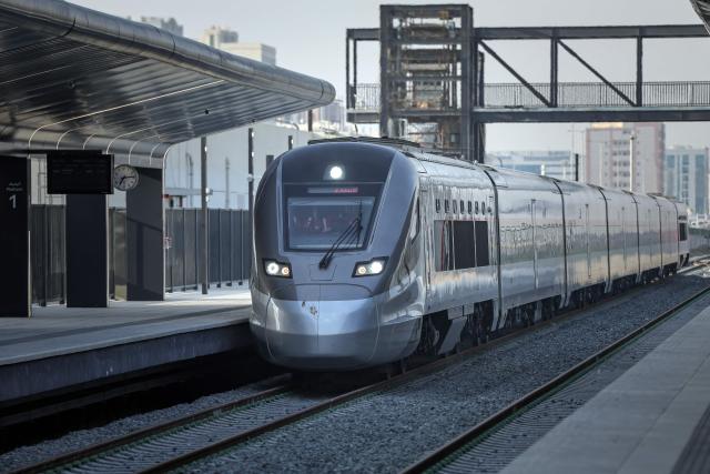A photograph shows an Etihad Rail train, the UAE's first passenger train, on its inaugural journey at Mohamed bin Zayed City station in Abu Dhabi on June 30, 2026. The passenger service will eventually connect four of the country's seven emirates, with an "introductory operational phase" between Abu Dhabi and Fujairah to begin on June 30, state news agency WAM said earlier this month. The Dubai station will open on September 30, while the main station in the neighbouring emirate of Sharjah is set to be operational on March 30, 2027. (Photo by FADEL SENNA / AFP)