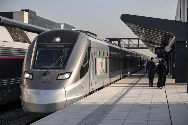 A photograph shows an Etihad Rail train, the UAE's first passenger train, on its inaugural journey at Mohamed bin Zayed City station in Abu Dhabi on June 30, 2026. The passenger service will eventually connect four of the country's seven emirates, with an "introductory operational phase" between Abu Dhabi and Fujairah to begin on June 30, state news agency WAM said earlier this month. The Dubai station will open on September 30, while the main station in the neighbouring emirate of Sharjah is set to be operational on March 30, 2027. (Photo by FADEL SENNA / AFP)