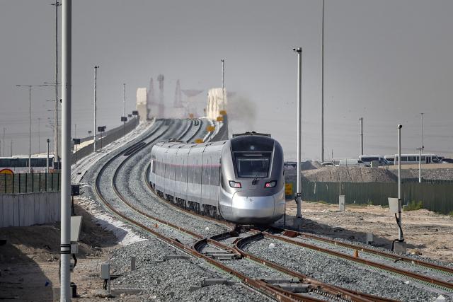 A photograph shows an Etihad Rail train, the UAE's first passenger train, on its inaugural journey at Mohamed bin Zayed City station in Abu Dhabi on June 30, 2026. The passenger service will eventually connect four of the country's seven emirates, with an "introductory operational phase" between Abu Dhabi and Fujairah to begin on June 30, state news agency WAM said earlier this month. The Dubai station will open on September 30, while the main station in the neighbouring emirate of Sharjah is set to be operational on March 30, 2027. (Photo by FADEL SENNA / AFP)