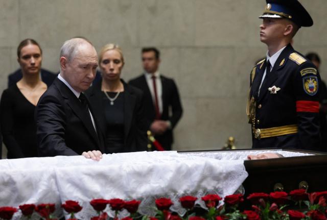 In this pool photograph distributed by the Russian state agency Sputnik, Russia's President Vladimir Putin pays his last respects to the late former defence minister Sergei Ivanov during a farewell ceremony in Moscow on June 30, 2026. (Photo by Gavriil Grigorov / POOL / AFP)