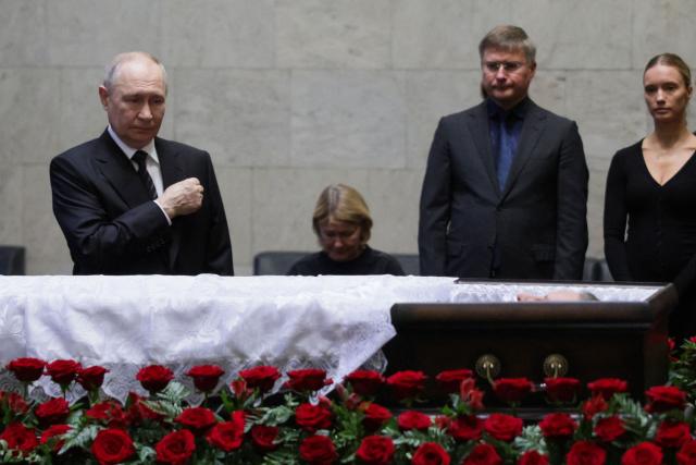 In this pool photograph distributed by the Russian state agency Sputnik, Russia's President Vladimir Putin pays his last respects to the late former defence minister Sergei Ivanov during a farewell ceremony in Moscow on June 30, 2026. (Photo by Gavriil Grigorov / POOL / AFP)