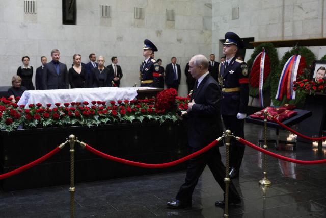 In this pool photograph distributed by the Russian state agency Sputnik, Russia's President Vladimir Putin pays his last respects to the late former defence minister Sergei Ivanov during a farewell ceremony in Moscow on June 30, 2026. (Photo by Gavriil Grigorov / POOL / AFP)