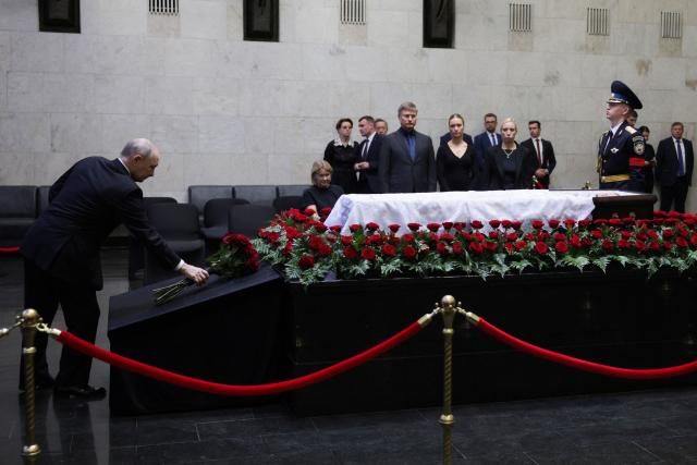 In this pool photograph distributed by the Russian state agency Sputnik, Russia's President Vladimir Putin pays his last respects to the late former defence minister Sergei Ivanov during a farewell ceremony in Moscow on June 30, 2026. (Photo by Gavriil Grigorov / POOL / AFP)