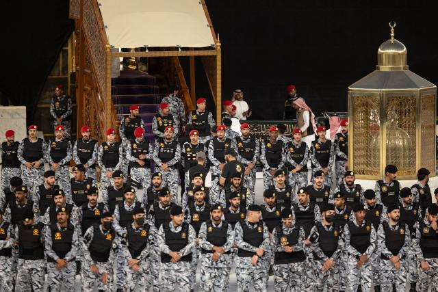 Saudi security forces stand guard during the annual washing ceremony of the Kaaba, Islam’s holiest shrine, at the Grand Mosque in Mecca on June 30, 2026. (Photo by AFP)