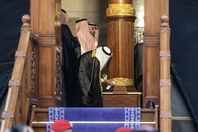 Officials take part in the annual washing ceremony of the Kaaba, Islam’s holiest shrine, at the Grand Mosque in Mecca on June 30, 2026. (Photo by AFP)