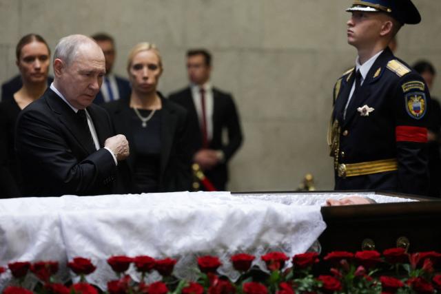 In this pool photograph distributed by the Russian state agency Sputnik, Russia's President Vladimir Putin pays his last respects to the late former defence minister Sergei Ivanov during a farewell ceremony in Moscow on June 30, 2026. (Photo by Gavriil Grigorov / POOL / AFP)