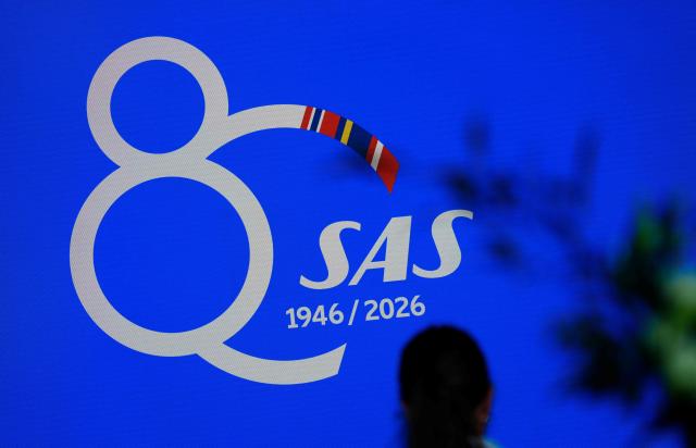 The logo of SAS airline is pictured during the press conference by the CEO of the company about the airline's future plans for Scandinavia, at Copenhagen Airport in Copenhagen on June 30, 2026. With its largest investment ever, SAS will spend more than ten billion dollars on up to 40 new Airbus aircraft, it is stated at the press conference. (Photo by Ida Marie Odgaard / Ritzau Scanpix / AFP) / Denmark OUT
