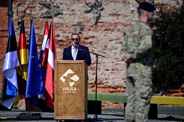 German Defence Minister Boris Pistorius (C) speaks during a NATO Change of Command ceremony on June 30, 2026 in Valka (Latvia) or Valga (Estonia). A joint German-Dutch army corps (1GNC) is taking command of NATO land forces in Latvia and Estonia. Officially transitioning on June 30, 2026, this move establishes a dedicated second corps headquarters on the eastern flank to speed up reinforcements and command combat operations in the Baltic region. (Photo by John MACDOUGALL / AFP)