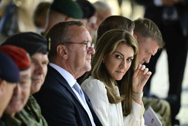 German Defence Minister Boris Pistorius (C) and Dutch Defence Minister Dilan Yesilgoz-Zegerius (C R) attend a NATO Change of Command ceremony on June 30, 2026 in Valka (Latvia) or Valga (Estonia). A joint German-Dutch army corps (1GNC) is taking command of NATO land forces in Latvia and Estonia. Officially transitioning on June 30, 2026, this move establishes a dedicated second corps headquarters on the eastern flank to speed up reinforcements and command combat operations in the Baltic region. (Photo by John MACDOUGALL / AFP)