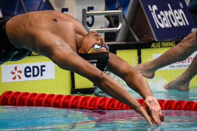 France’s Yohann Ndoye-Brouard competes in the 50-metres backstroke heat during the French national swimming championships at Saint-Etienne on June 30,2026. (Photo by OLIVIER CHASSIGNOLE / AFP)