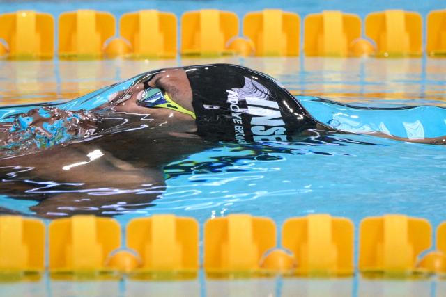 France’s Yohann Ndoye-Brouard competes in the 50-metres backstroke heat during the French national swimming championships at Saint-Etienne on June 30,2026. (Photo by OLIVIER CHASSIGNOLE / AFP)