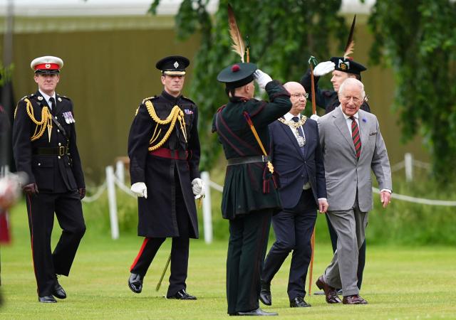 Britain's King Charles III (R) arrives to attend the traditional "Ceremony of the Keys" in the Gardens of the Palace of Holyroodhouse in Edinburgh, Scotland on June 30, 2026, on the first day of the king and queen's visit to Scotland. (Photo by Aaron Chown / POOL / AFP)