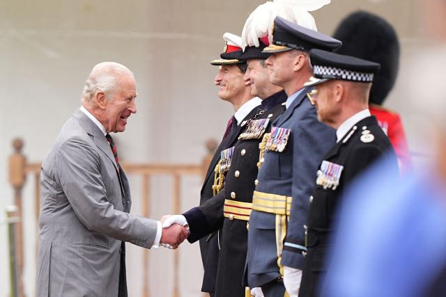 Britain's King Charles III (L) arrives to attend the traditional "Ceremony of the Keys" in the Gardens of the Palace of Holyroodhouse in Edinburgh, Scotland on June 30, 2026, on the first day of the king and queen's visit to Scotland. (Photo by Aaron Chown / POOL / AFP)
