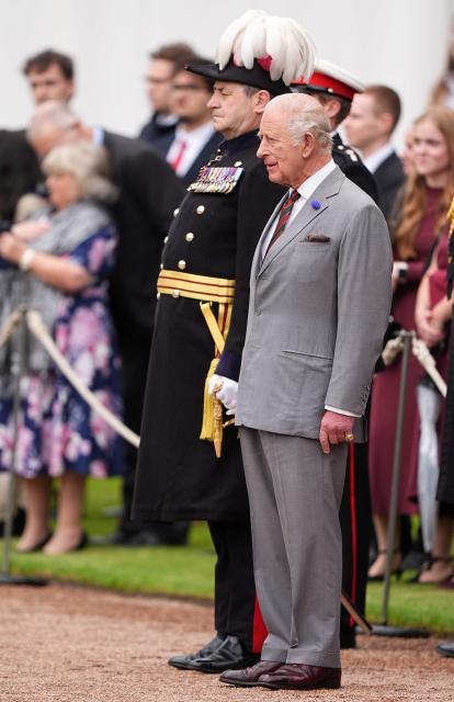 Britain's King Charles III (R) attends the traditional "Ceremony of the Keys" in the Gardens of the Palace of Holyroodhouse in Edinburgh, Scotland on June 30, 2026, on the first day of the king and queen's visit to Scotland. (Photo by Aaron Chown / POOL / AFP)